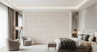 Whispered Arches wallpaper in pale beige arch pattern behind a cream bed and twin armchairs in a luxe bedroom