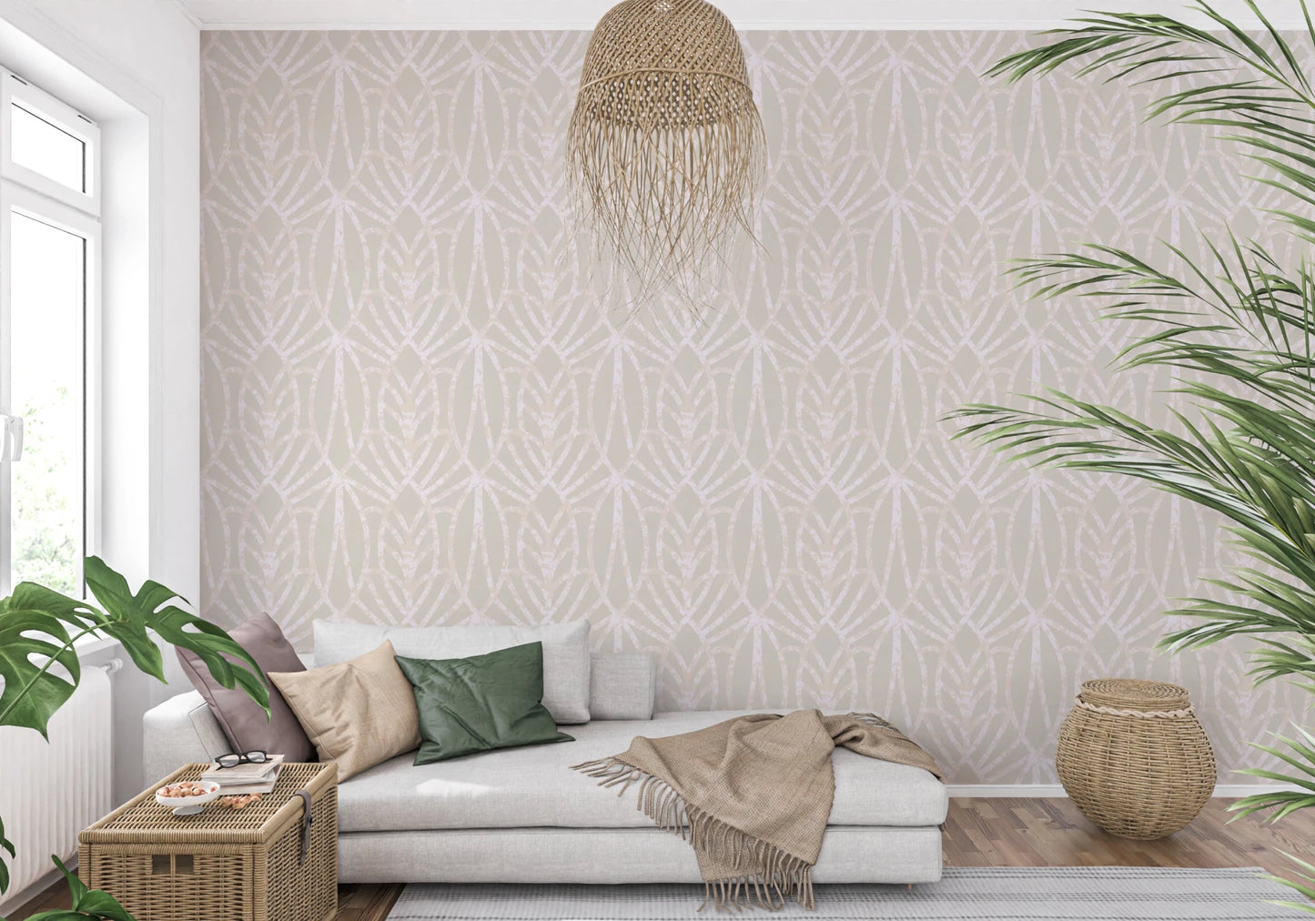 Whispered Arches wallpaper with a cream and blush arch motif behind a grey chaise sofa and rattan pendant in a living room