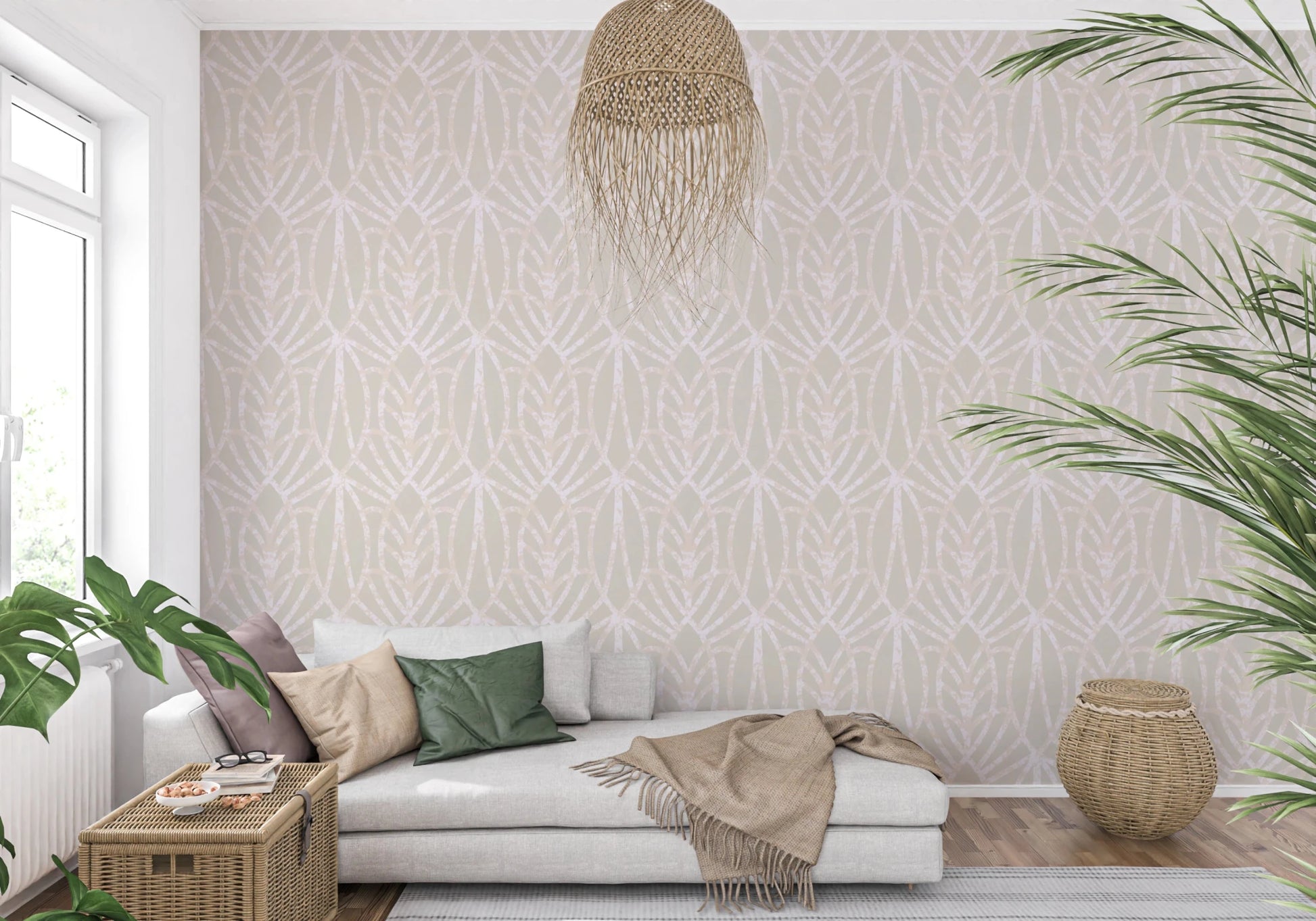 Whispered Arches wallpaper with a cream and blush arch motif behind a grey chaise sofa and rattan pendant in a living room