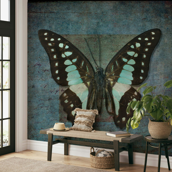 Whispering Butterfly Aura wallpaper mural of a teal and black butterfly behind a wood entryway bench and monstera