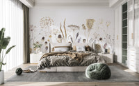 Whispering Meadows wallpaper mural of beige dried flowers behind a brown-linen bed in a bright bedroom
