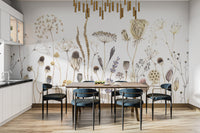 Whispering Meadows wallpaper mural of dried wildflowers behind a wood dining table with blue chairs in a kitchen