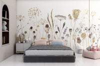 Whispering Meadows wallpaper mural of pastel wildflowers above a kids bed with pink pillows and plush toys