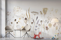 Whispering Meadows wallpaper mural of neutral dried blooms behind two grey chairs and a red rocking horse in a kids room