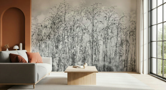 Whispering Weeds wallpaper mural in soft grey meadow grasses behind a grey sofa beside a terracotta arch living room