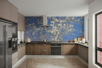 White Blossoms Against a Clear Blue Sky spring photography wall mural on a kitchen wall with wood cabinets and stainless fridge