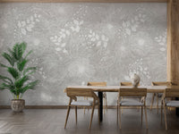 Elegant White and Gray Floral wallpaper of white sketched flowers behind a wood dining table and tall green palm in a dining room