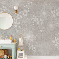 Elegant White and Gray Floral wallpaper of white outline flowers above a mint vanity and gold mirror in a bathroom