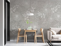 Elegant White and Gray Floral wallpaper with white line-art blooms behind a light wood dining table and white pendant in a dining nook
