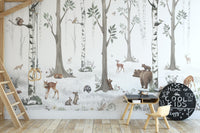 White Forest wallpaper of birch trees, deer and bears beside a loft bed ladder in a kids room