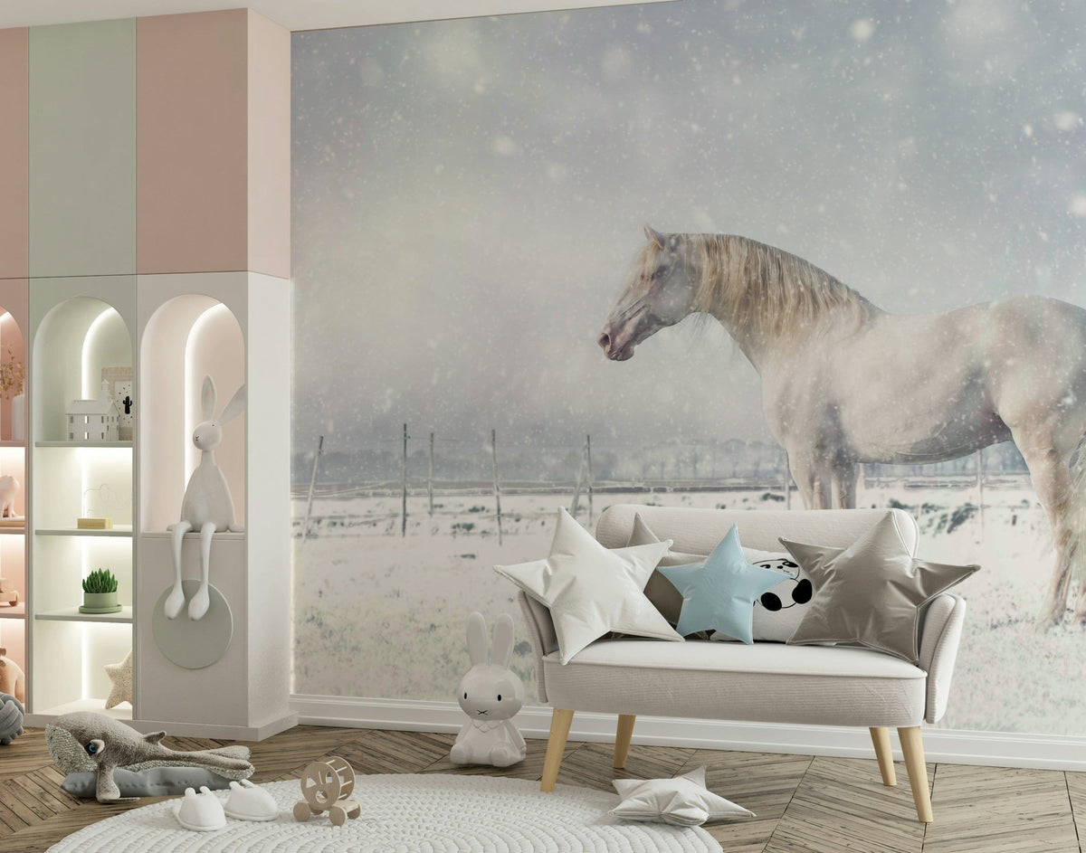 Snowdrift Horse wallpaper mural with a white horse in falling snow behind a cream loveseat in a pastel kids room
