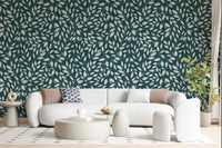 White Vines on Teal wallpaper behind a white curved sofa and round ottomans in a soft modern living room