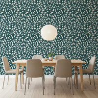 White Vines on Teal wallpaper behind a light wood dining table and beige chairs under a paper lantern pendant