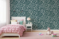 White Vines on Teal wallpaper in a girls bedroom with a white bed, pink ruffle bedding and a unicorn toy