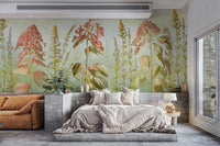 Wild Flowers Meadows wallpaper mural of coral blooms behind a platform bed and rust sofa in a modern bedroom