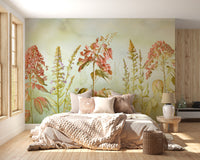 Wild Flowers Meadows wallpaper mural of pink wildflowers above a blush knit bed in a bright bedroom with light wood floor
