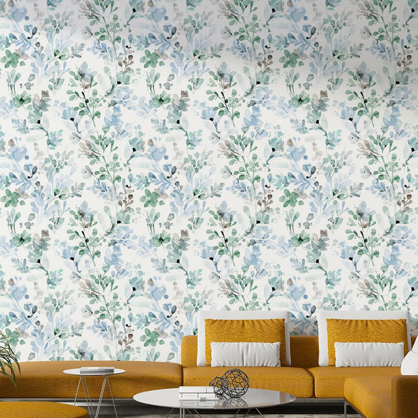 Nature inspired green wall décor for a guest bedroom with wicker furniture.