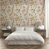 Elegant gold botanical wall decor with plant patterns for a modern apartment living room.