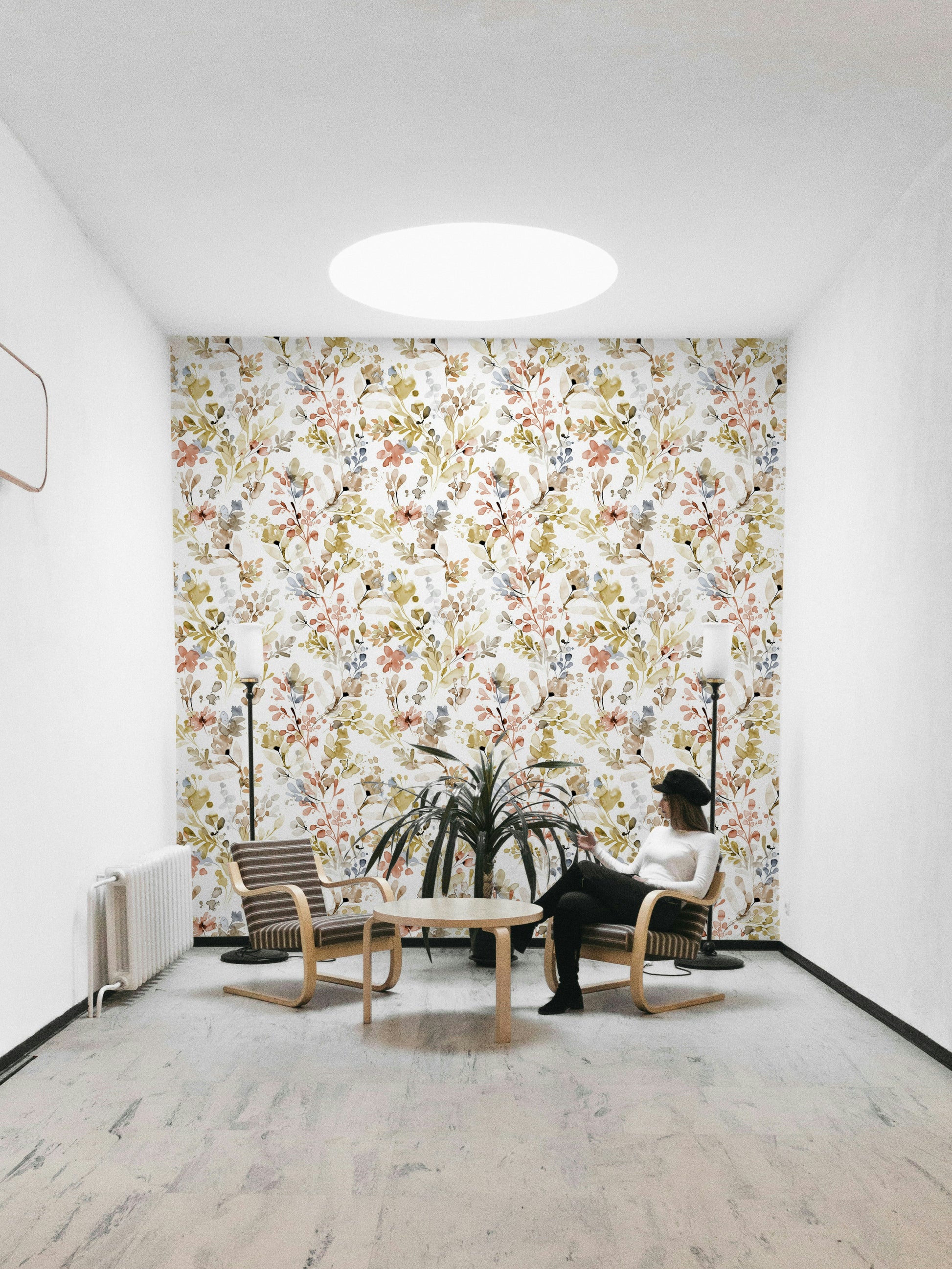 Wild Nature Plants Gold Wallpaper in a library with dark leather seating.