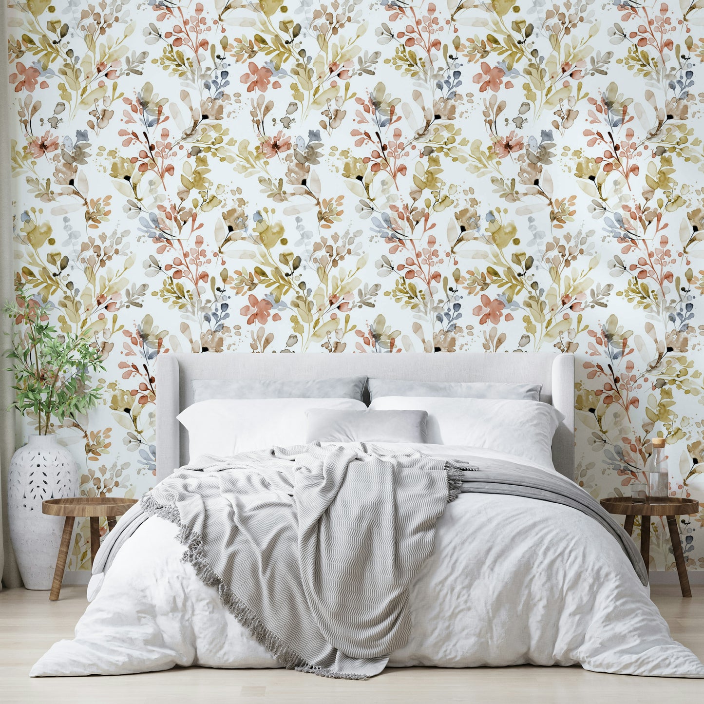 Shimmering botanical print in a contemporary bathroom with brass taps and mirrors.