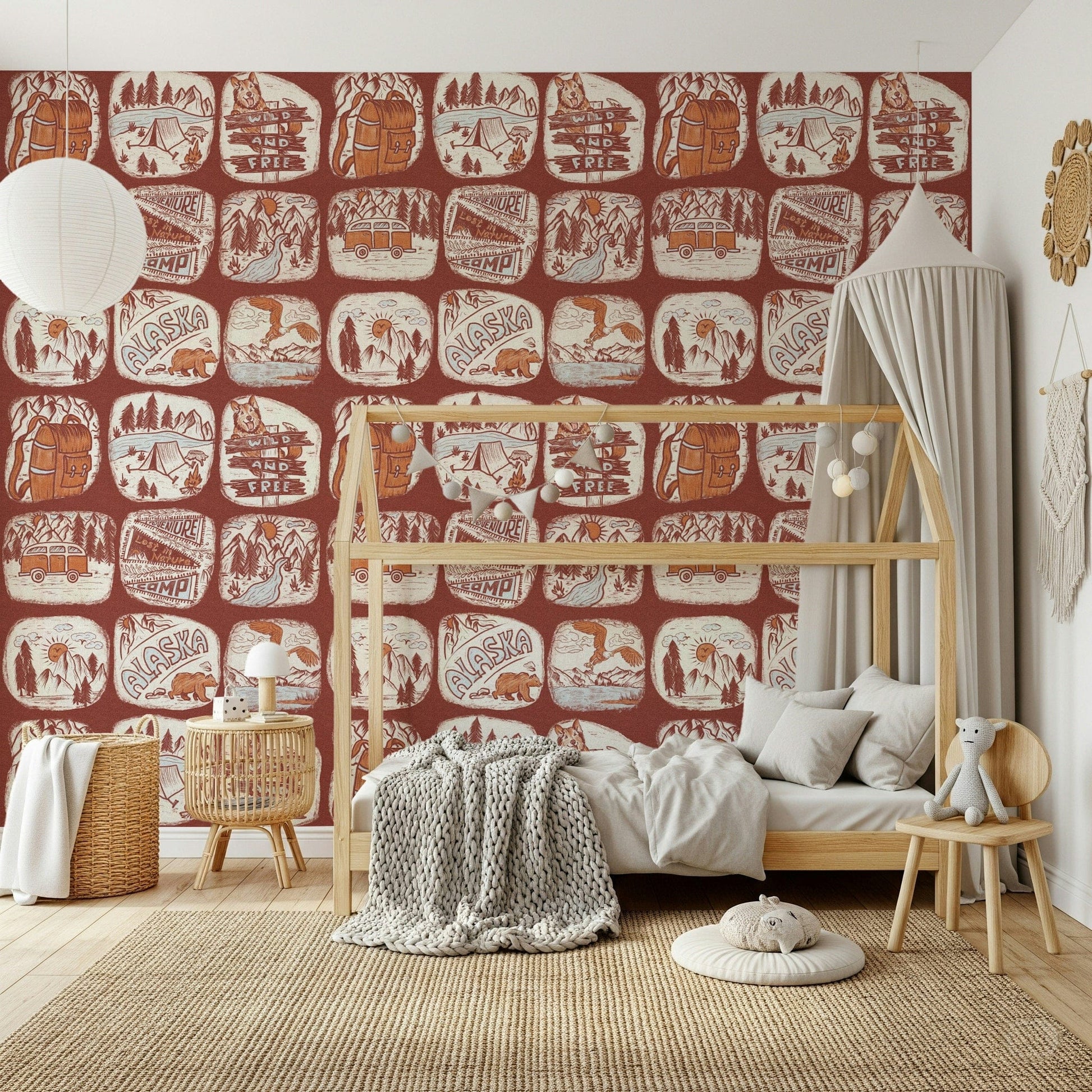 Wilderness Patches wallpaper mural capturing illustrated badges of rugged landscapes and wildlife.