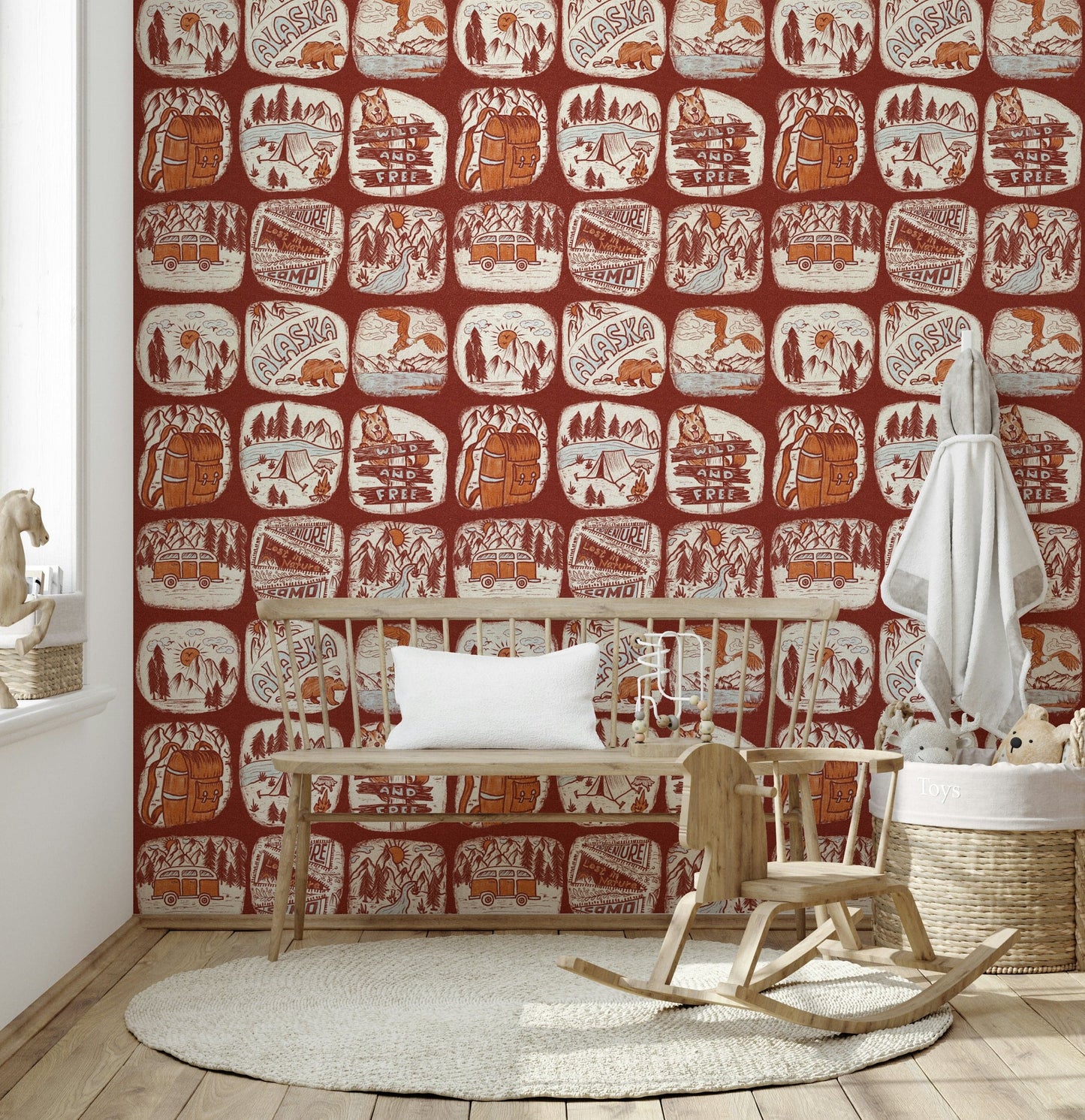 Wilderness Patches wallpaper mural displaying vintage-style illustrations of mountains, vans, and tents.