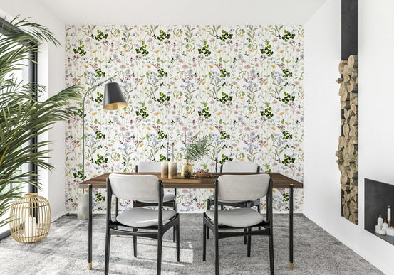 Wildflower Early Summer Meadow Wallpaper behind a tan leather lounge suite.