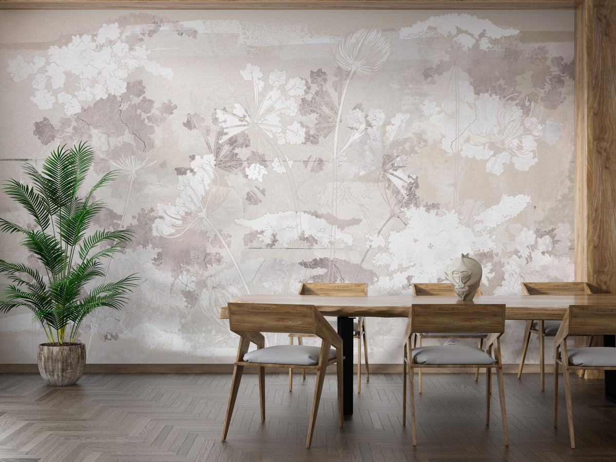 Wildflowers on brown concrete wallpaper mural in beige tones behind a wood dining table and palm plant