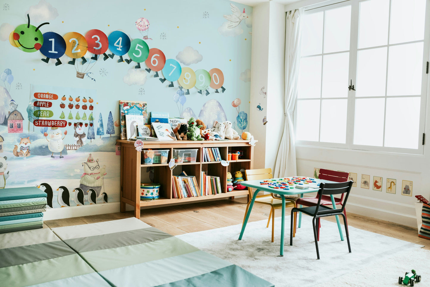 The design features soft snowflakes and snow-covered trees.

