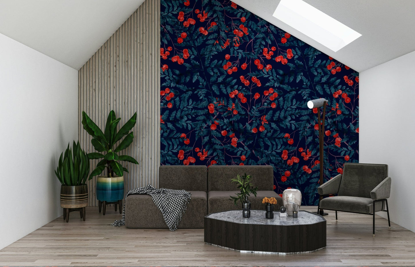 Winter Berries wallpaper in navy and red behind a grey sofa under a sloped ceiling with plants