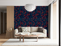 Winter Berries wallpaper in navy and red behind a cream sofa and oval wood table in a living room