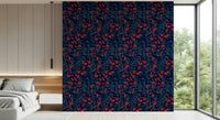 Winter Berries wallpaper in navy with red berries behind a white platform bed with a garden view