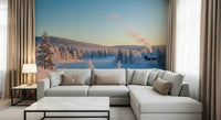 Snowy cabin wall mural in modern living room, soft blue-white color scene