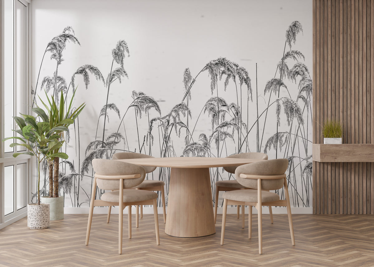 Winter Reeds wallpaper mural of black and white reeds behind blue cabinets and a sink in a bright kitchen