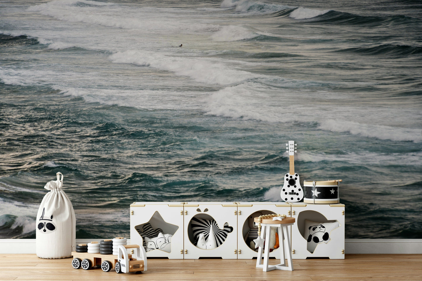 A bedroom with the winter surfing mural behind the headboard.

