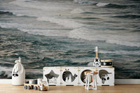 A bedroom with the winter surfing mural behind the headboard.

