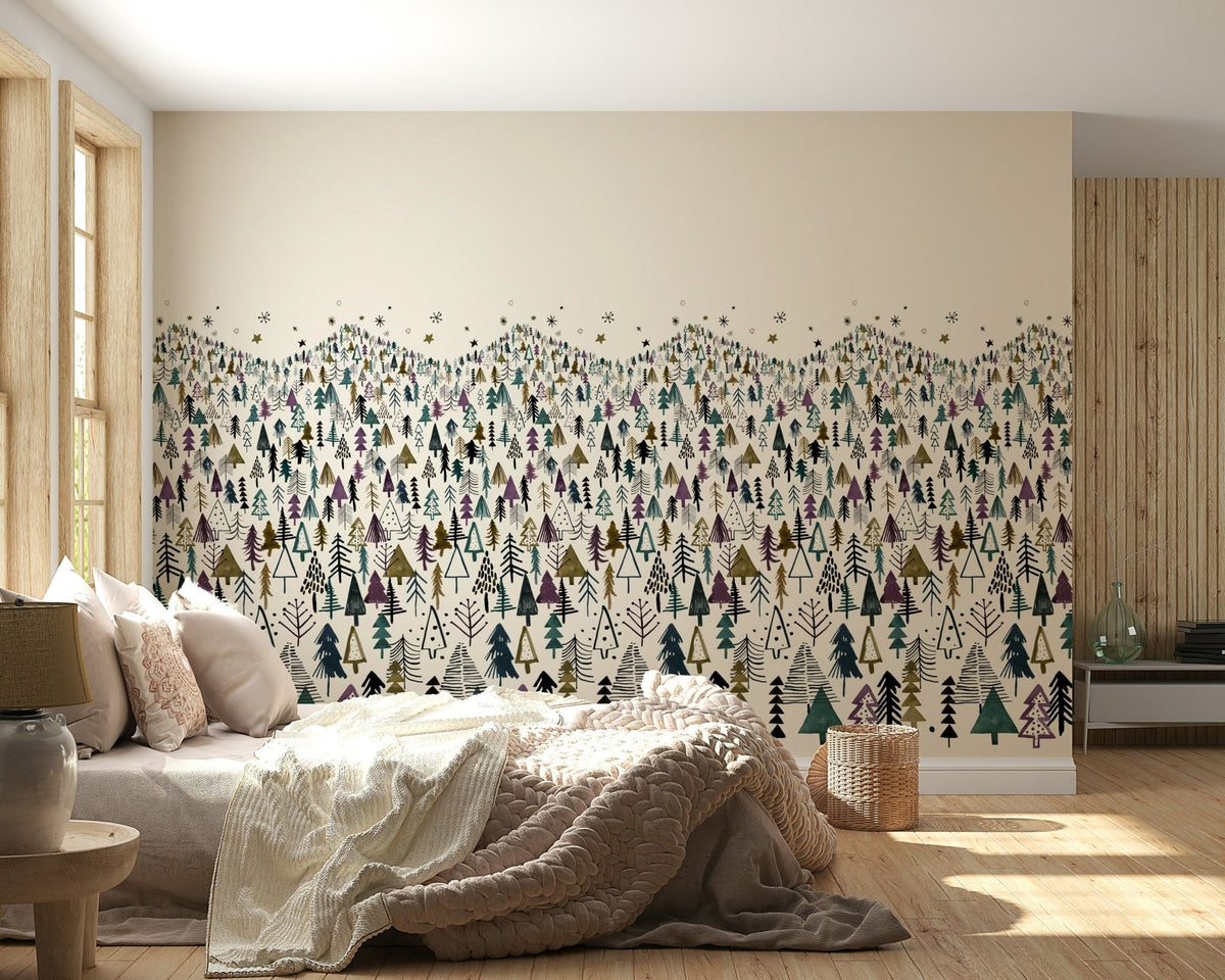 Winter Tree Wonderland wallpaper mural of teal and purple pine trees behind a neutral bed in a bedroom