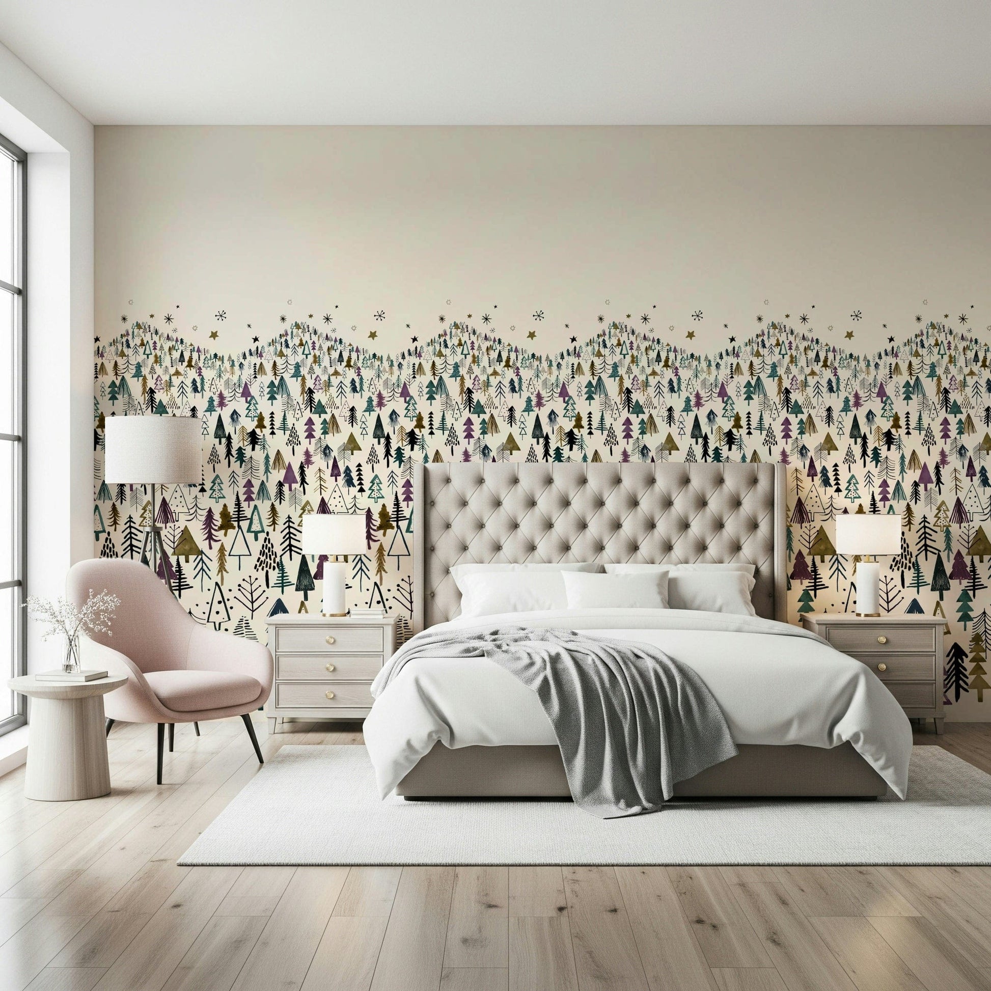 Winter Tree Wonderland wallpaper mural behind a tufted grey headboard with a pink chair in a bedroom