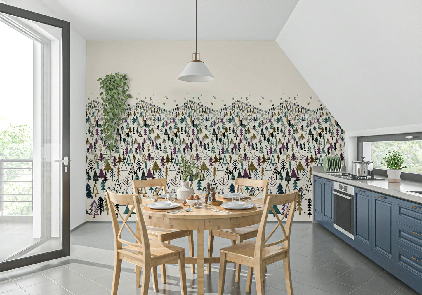 Winter Tree Wonderland wallpaper mural of pine forest beside a round wooden dining table and blue kitchen