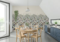 Winter Tree Wonderland wallpaper mural of pine forest beside a round wooden dining table and blue kitchen