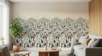 Winter Tree Wonderland wallpaper mural of pine trees behind a cream sofa and round wooden coffee table