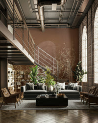 The design features delicate, bare tree branches or twigs.

