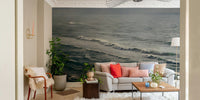 A bedroom with the winter surfing mural behind the headboard.


