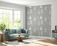Delicate winter tree outlines in white creating a soothing festive wallpaper look.