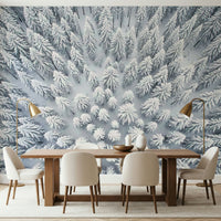 Snowy pine landscape mural behind sofa in apartment, modern wall decor style