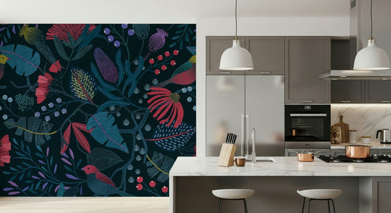 Wonderforest wallpaper mural with pink flowers on navy foliage on a kitchen wall by a marble island
