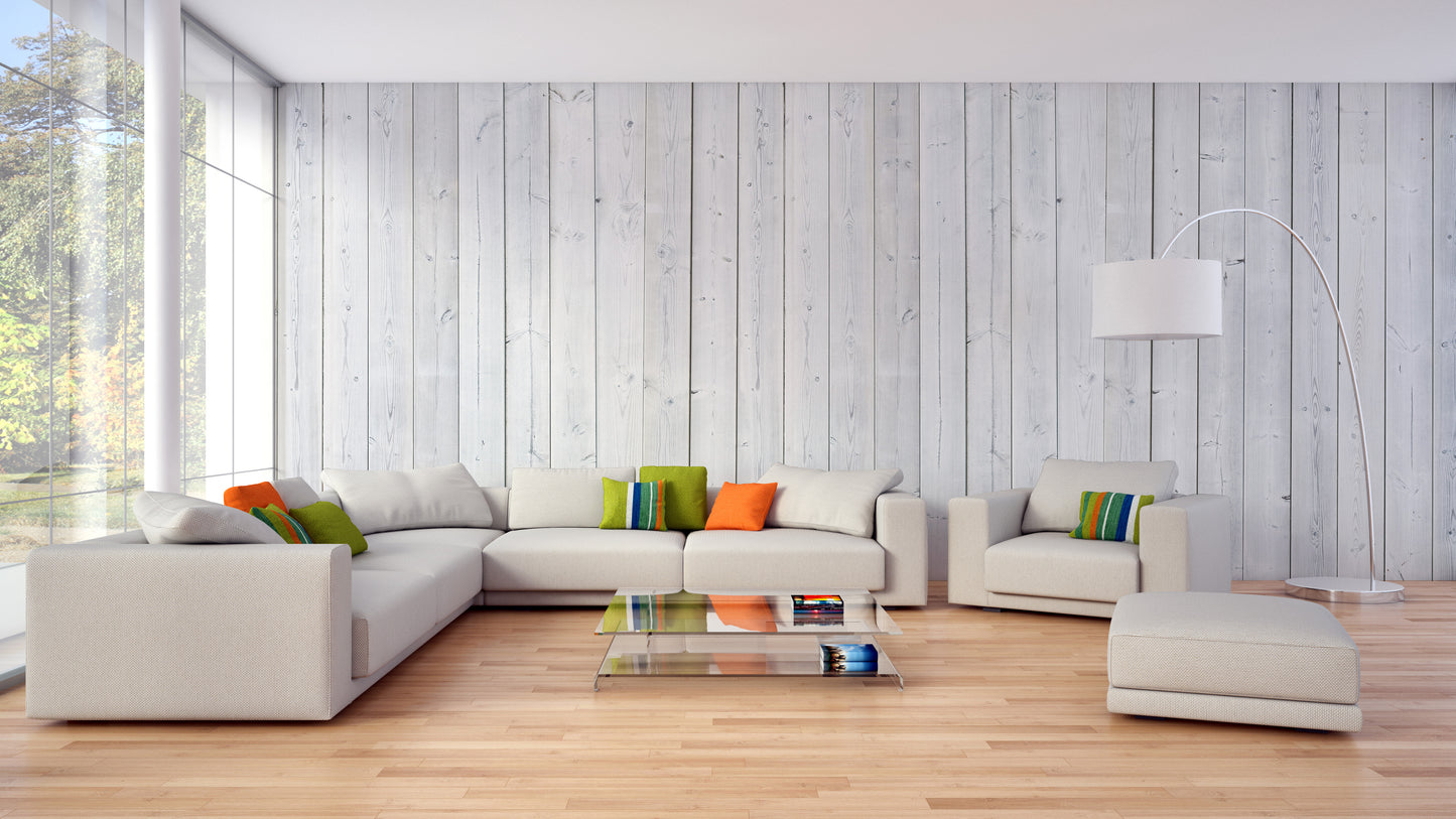 Wood Texture wallpaper in pale planks behind a cream sectional sofa and glass coffee table in a living room