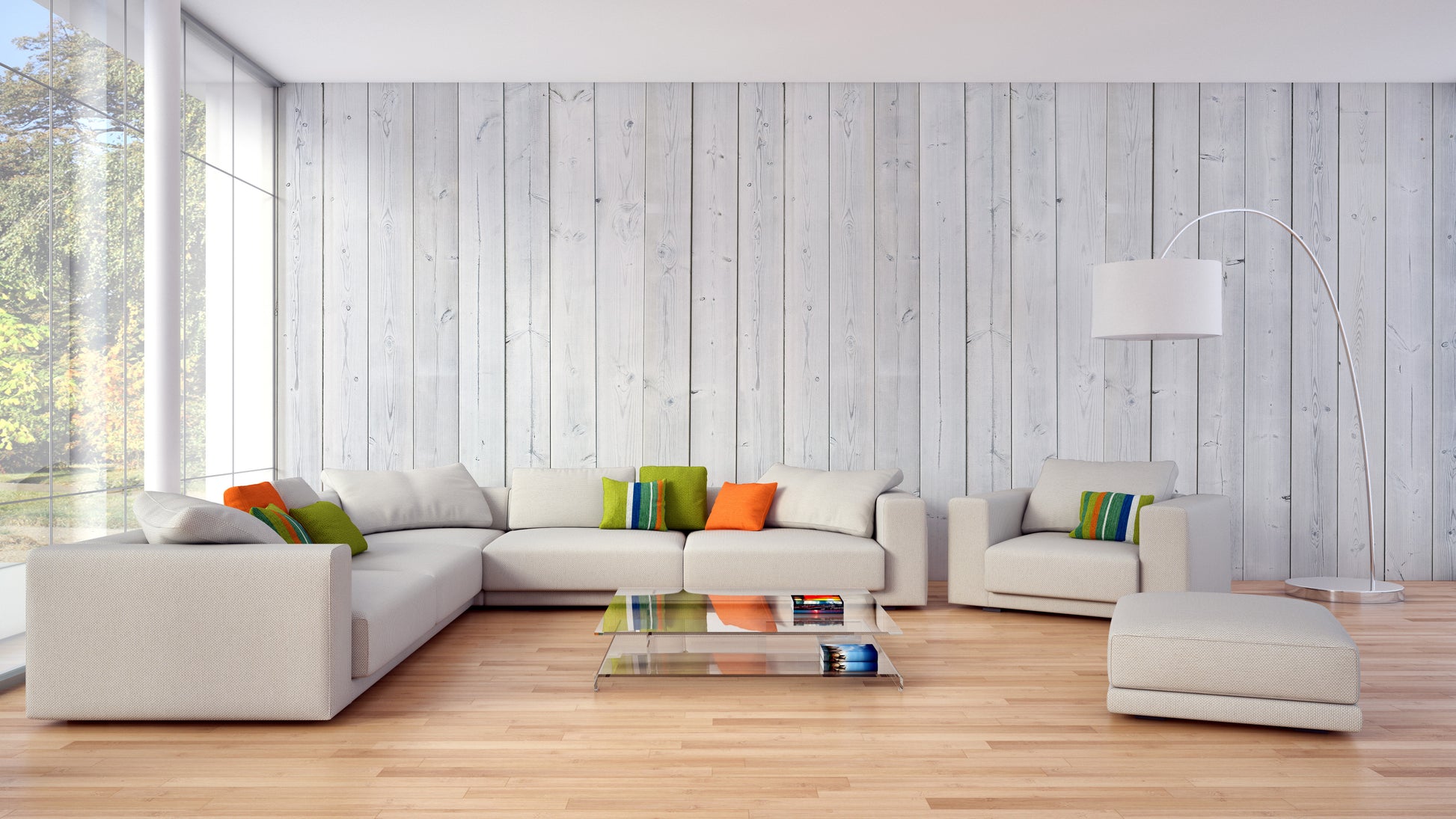 Wood Texture wallpaper in pale planks behind a cream sectional sofa and glass coffee table in a living room