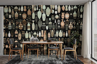 Woodcut Vase Design wallpaper mural of beige vases on black behind a wood dining table and black chairs