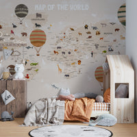 World Map Kids & Nursery wallpaper with animals behind a wooden house-frame bed in a kids bedroom
